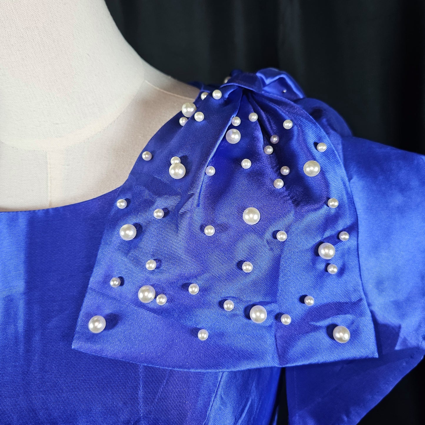 Royal Dynamics: Sapphire Ball Gown with Dramatic Flair