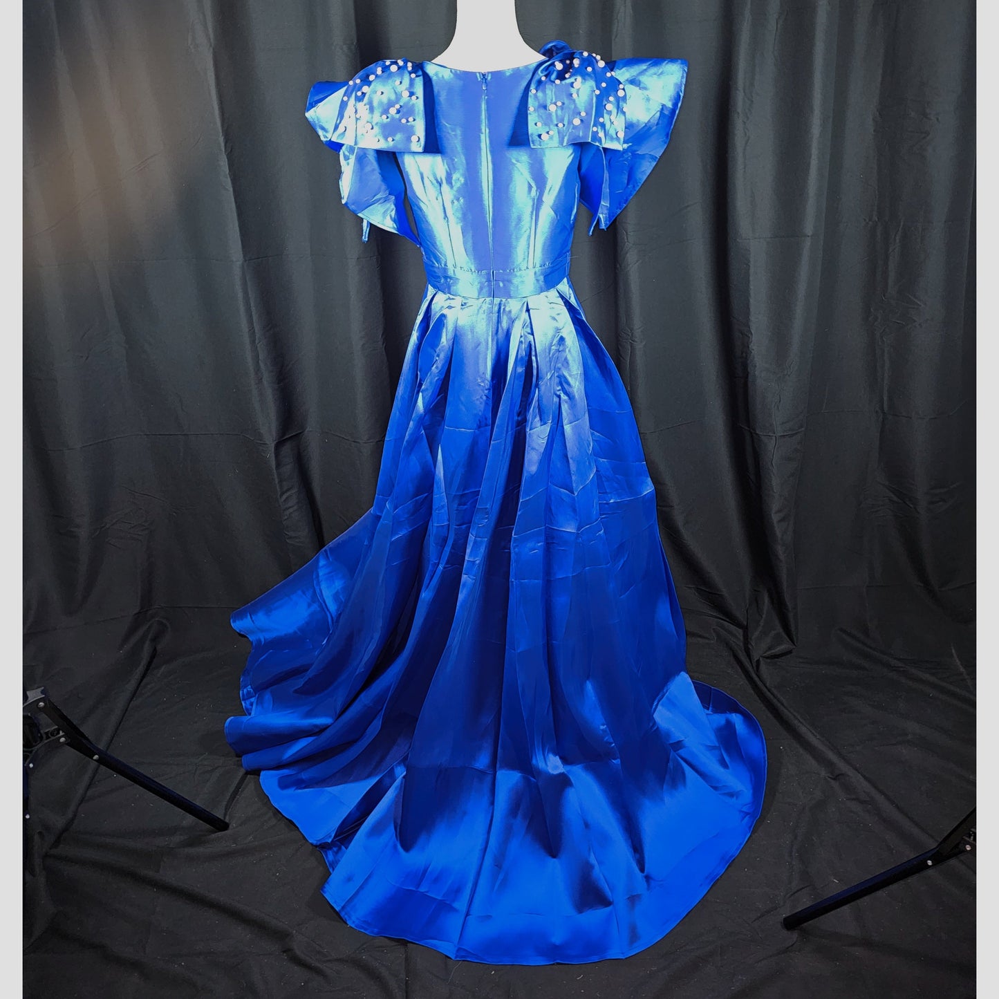 Royal Dynamics: Sapphire Ball Gown with Dramatic Flair