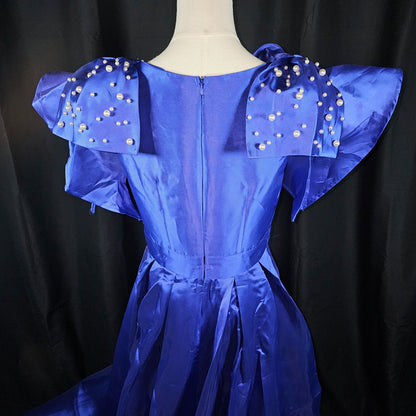 Royal Dynamics: Sapphire Ball Gown with Dramatic Flair