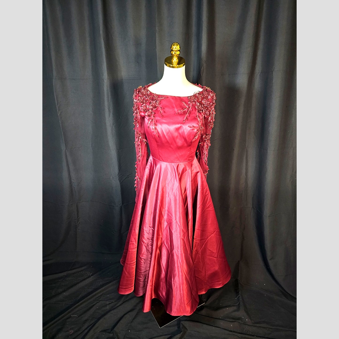 Garnet Gown: A Slice of Glamour with a Side of Drama