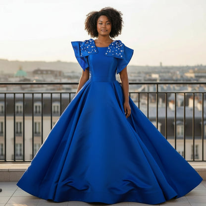 Royal Dynamics: Sapphire Ball Gown with Dramatic Flair